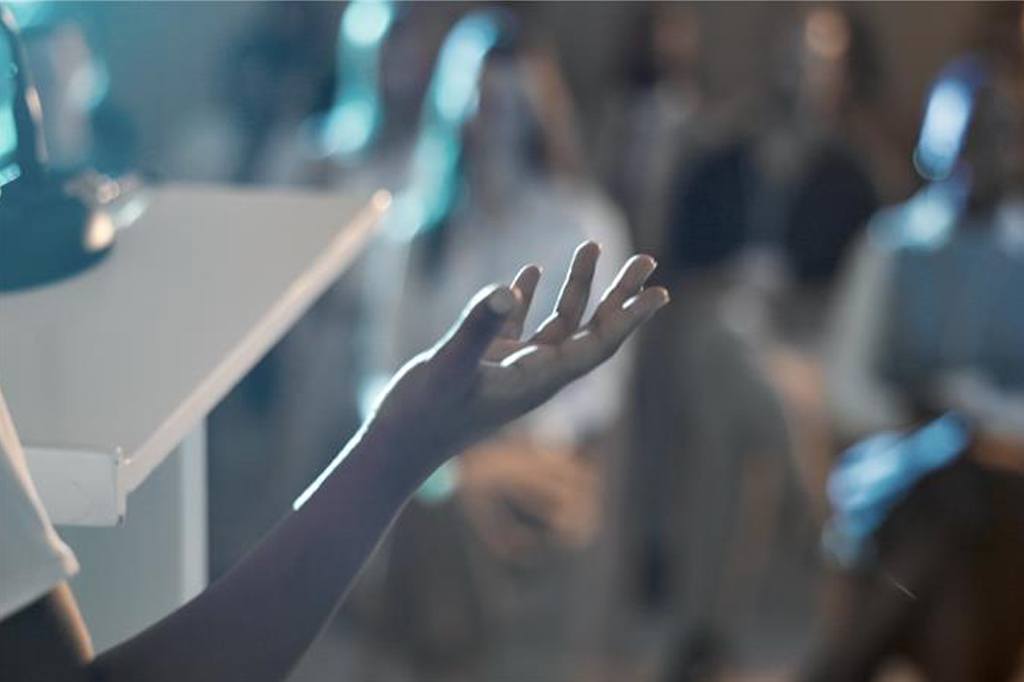 Speaker talking to crowd. Decorative